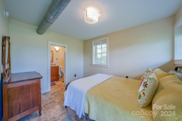 bedroom with connected bathroom