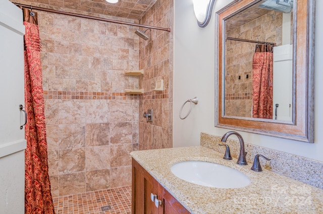 bathroom featuring vanity and a shower with shower curtain