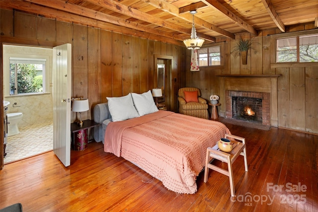 139 Neely Rd, Brevard, NC 28712 - bedroom with wooden walls, beam ceiling, wooden ceiling, and multiple windows