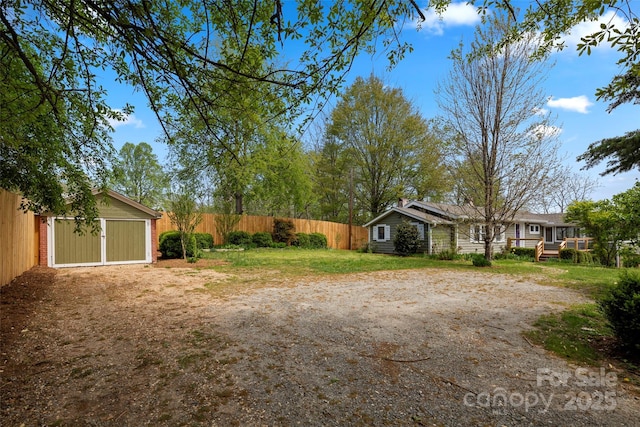 139 Neely Rd, Brevard, NC 28712 - view of yard featuring an outdoor structure, driveway, and fence