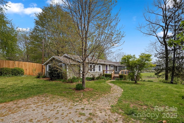 139 Neely Rd, Brevard, NC 28712 - exterior space with a wooden deck, fence, and a front yard