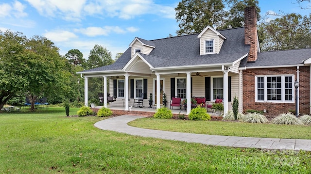 cape cod home featuring ceiling fan, a porch, and a front lawn