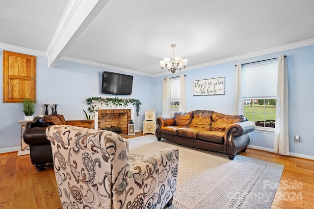 living room featuring light wood-type flooring, beam ceiling, a notable chandelier, a fireplace, and ornamental molding