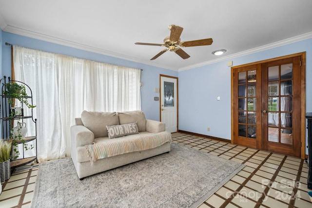 tiled living room with ornamental molding, ceiling fan, and french doors