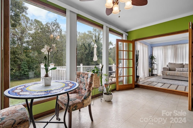 sunroom featuring ceiling fan