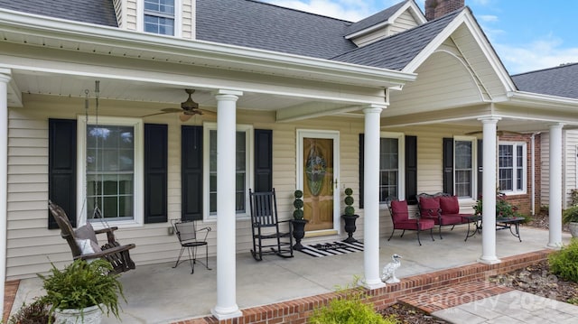 view of patio with ceiling fan and a porch