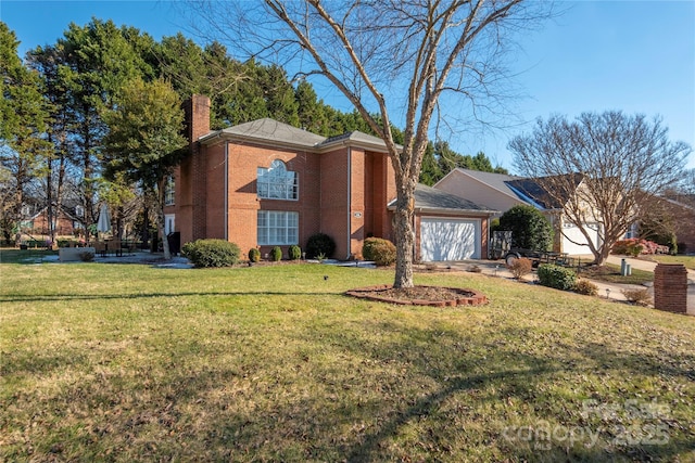 view of property featuring a front lawn and a garage