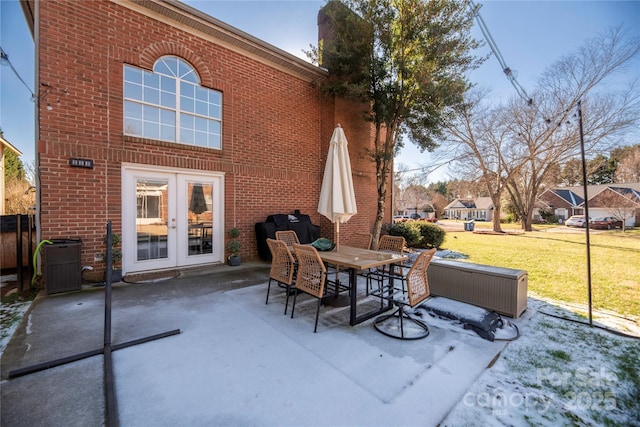 view of patio featuring french doors, central AC, and a grill