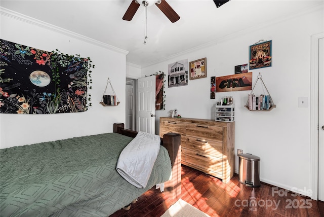 bedroom with ceiling fan, ornamental molding, and wood-type flooring