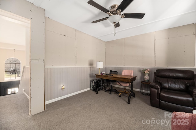 carpeted office with ceiling fan