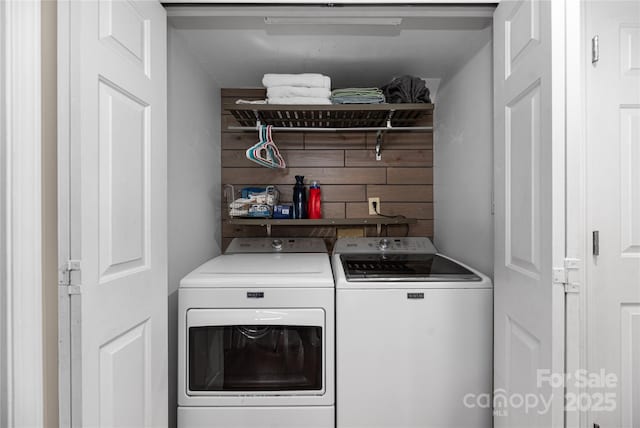 washroom featuring independent washer and dryer