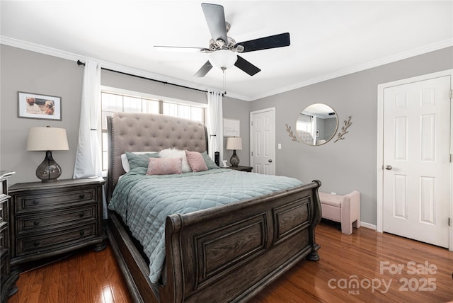 bedroom featuring hardwood / wood-style flooring, ceiling fan, and ornamental molding