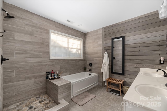 bathroom with sink, tile patterned flooring, and independent shower and bath