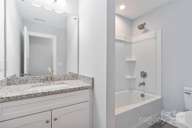 full bathroom featuring bathing tub / shower combination, vanity, toilet, and wood-type flooring