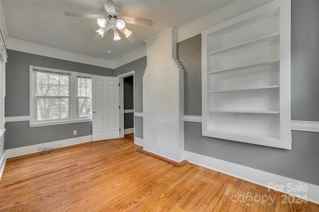 interior space with ceiling fan, crown molding, and light hardwood / wood-style floors