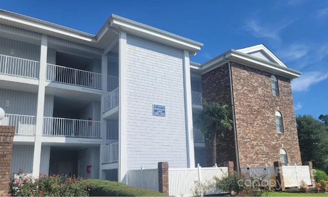 view of property exterior featuring brick siding