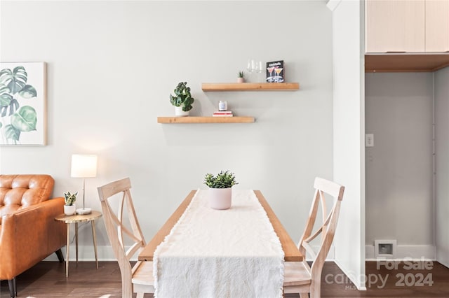 dining space featuring dark hardwood / wood-style floors