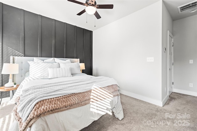 unfurnished bedroom featuring light colored carpet and ceiling fan