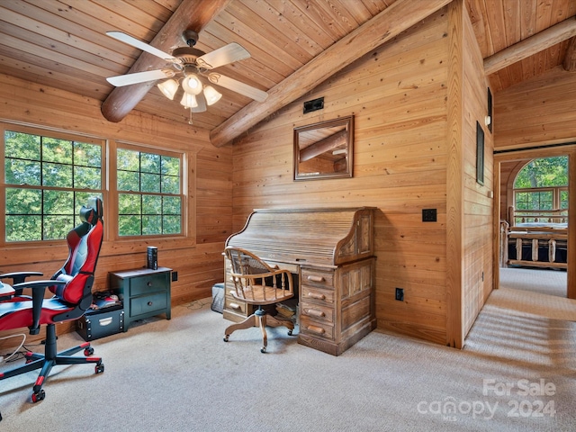 carpeted office space featuring wooden ceiling, vaulted ceiling with beams, wooden walls, and ceiling fan