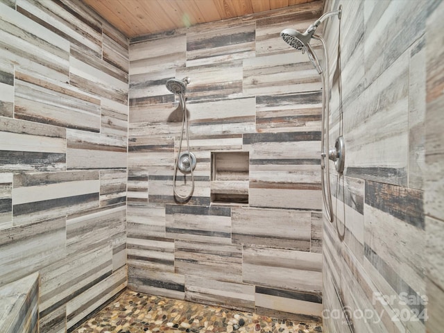 bathroom featuring walk in shower, wooden ceiling, and wooden walls