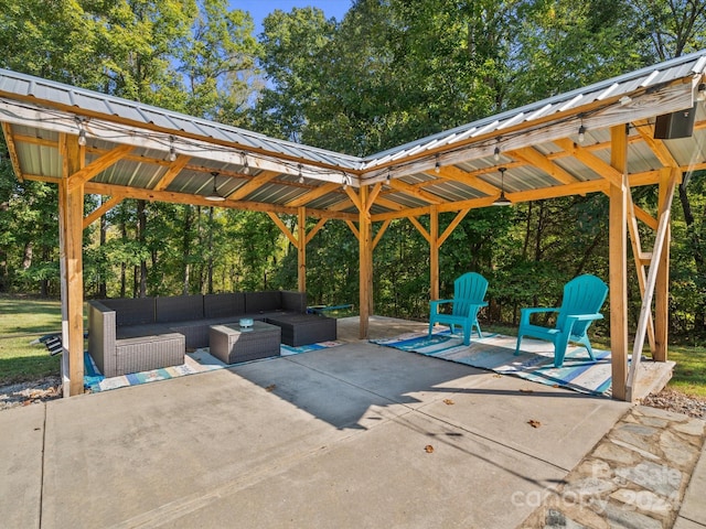 view of patio featuring a gazebo, outdoor lounge area, and ceiling fan