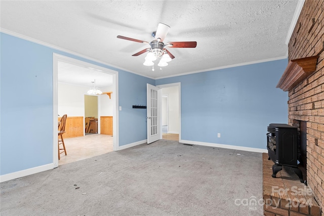 unfurnished living room with a textured ceiling, carpet flooring, and a wood stove