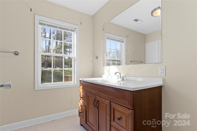 bathroom with vanity and tile patterned flooring