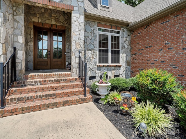 property entrance featuring french doors