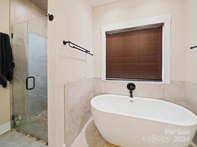 bathroom with plus walk in shower and tile patterned floors