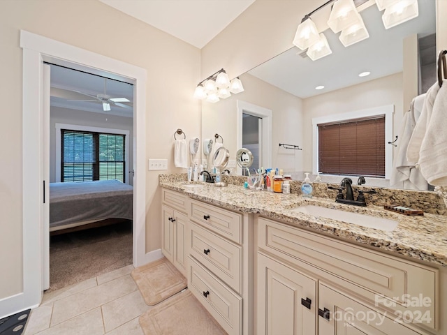 bathroom featuring tile patterned flooring, vanity, and ceiling fan