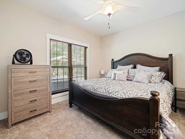 bedroom featuring ceiling fan and light carpet