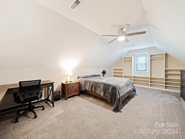 carpeted bedroom with vaulted ceiling and ceiling fan