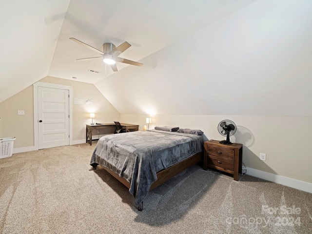 carpeted bedroom featuring lofted ceiling and ceiling fan