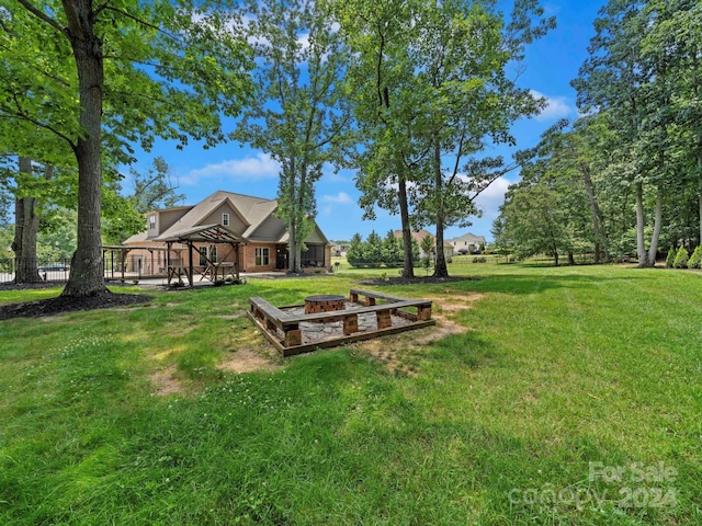 view of yard featuring an outdoor fire pit