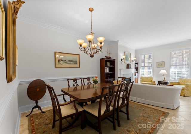 dining area featuring an inviting chandelier, crown molding, and light tile patterned flooring