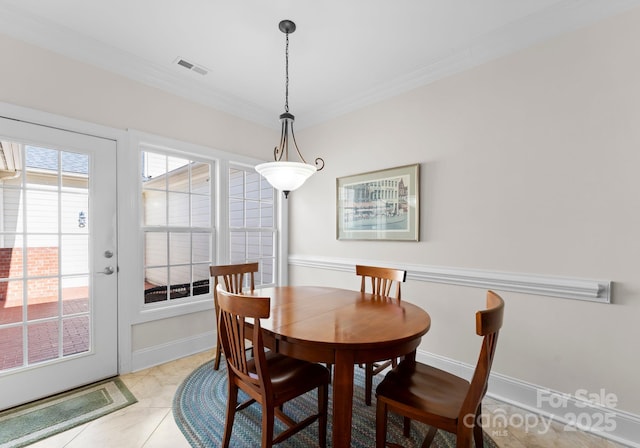 tiled dining area with ornamental molding