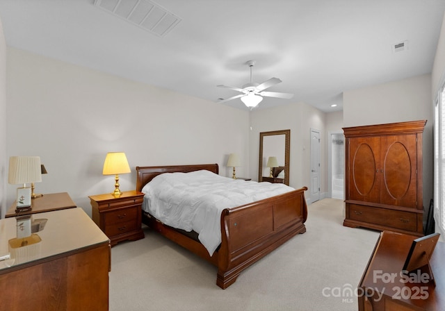 carpeted bedroom featuring a closet and ceiling fan