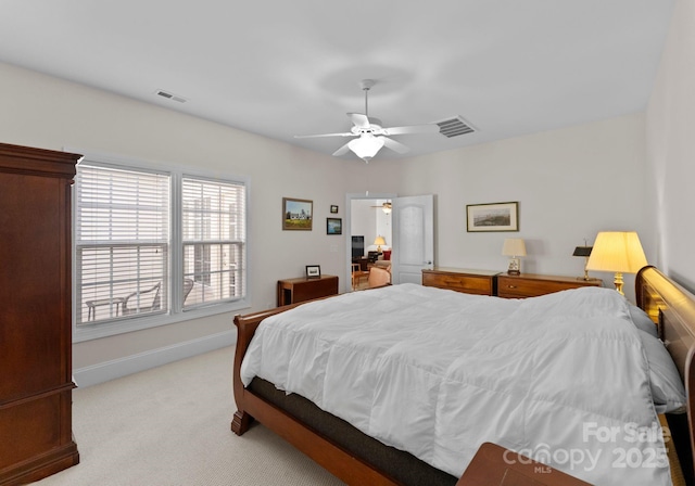 carpeted bedroom with ceiling fan