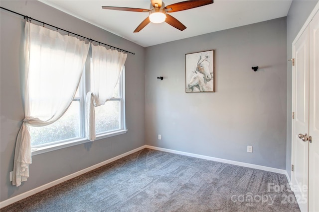 spare room with carpet and ceiling fan