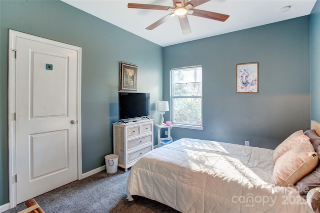 bedroom featuring dark carpet and ceiling fan