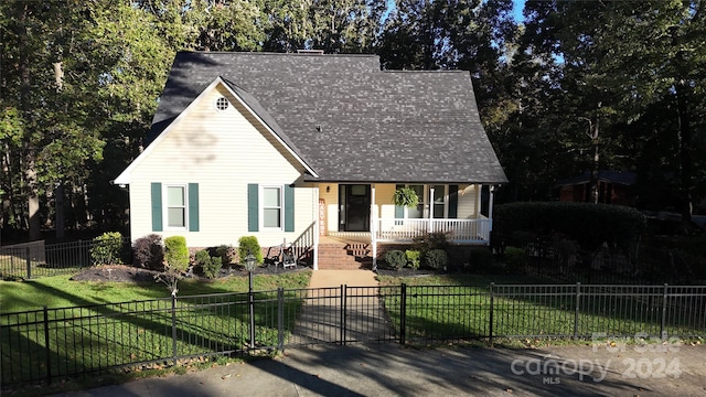 view of front of house featuring covered porch and a front lawn