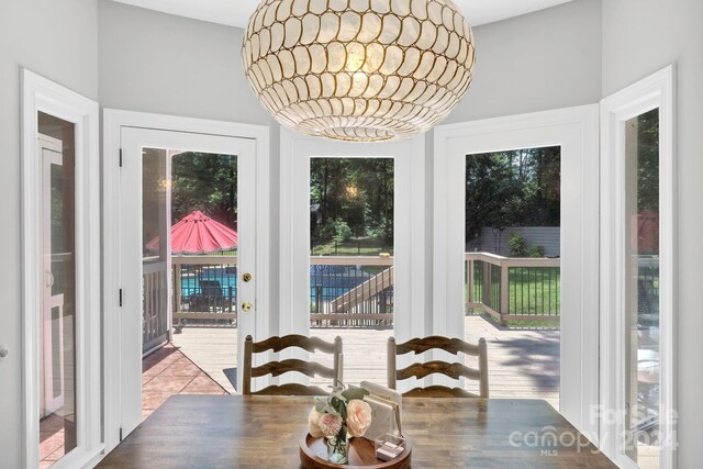 dining space with wood-type flooring and plenty of natural light