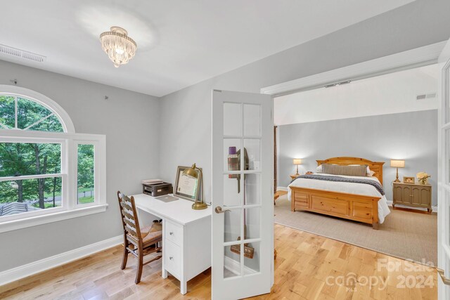 bedroom with light wood-type flooring