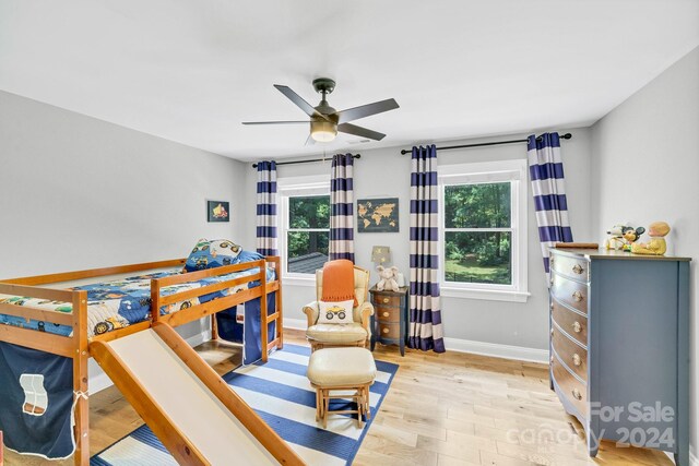 bedroom featuring light hardwood / wood-style flooring and ceiling fan