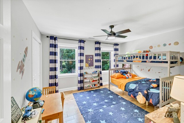 bedroom with ceiling fan and light hardwood / wood-style floors