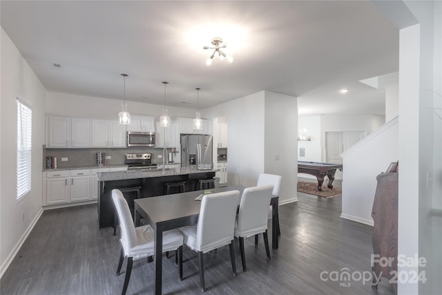 dining area featuring sink, pool table, and dark hardwood / wood-style flooring