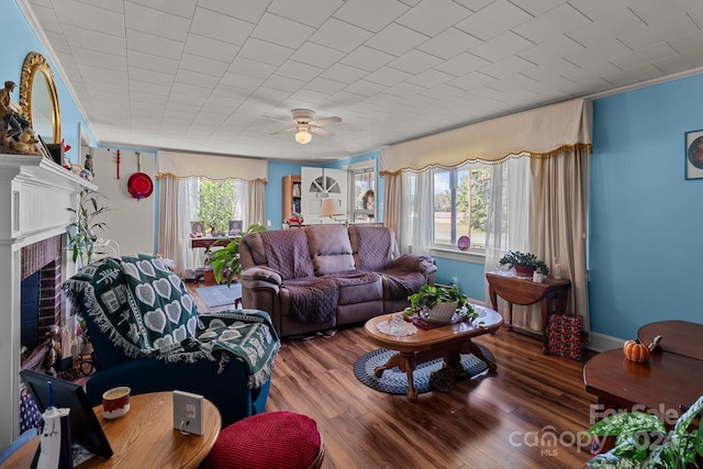 living room featuring hardwood / wood-style floors and ceiling fan