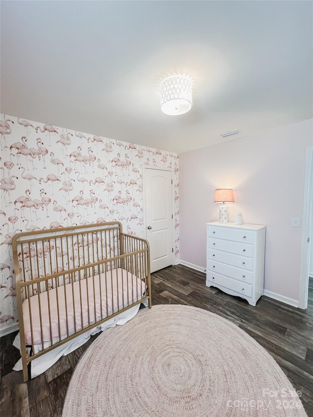 bedroom with dark wood-type flooring