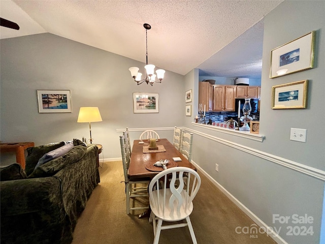 carpeted dining area with lofted ceiling, a textured ceiling, and ceiling fan with notable chandelier