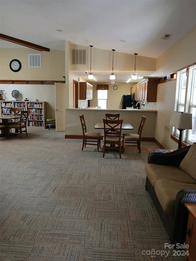 carpeted living room with lofted ceiling